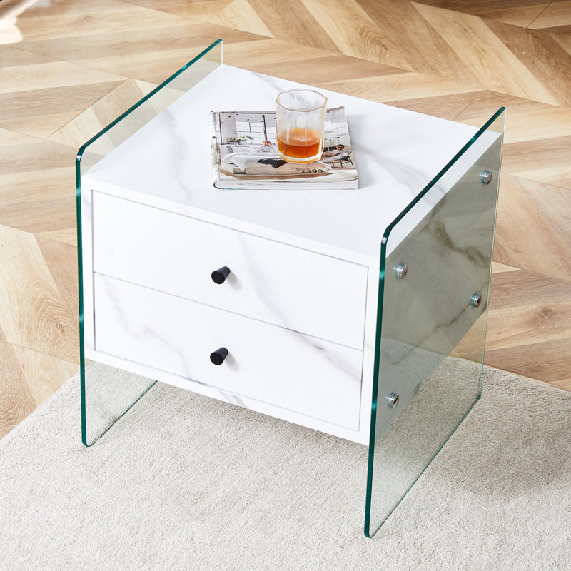 Double-Drawer Bedside Table. The Board Surface Is MDF With Wood Grain Sticker, And Both Sides Are Transparent Tempered Glass. The Design Is Simple And Elegant, With Excellent Storage Functions.