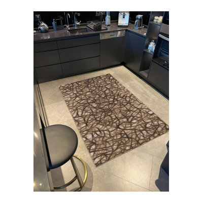 Tapis rond lavable rayé à motifs tissés