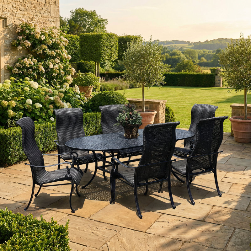 Hisham 6 - Person Patio Dining Set with Oval Table