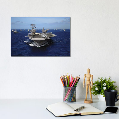 Aircraft Carrier USS Ronald Reagan Leads A Mass Formation Of Ships Through The Pacific Ocean by Stocktrek Images - Wrapped Canvas Print