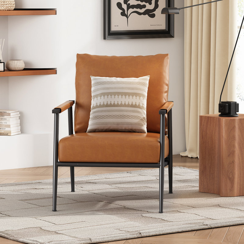 Chaise rembourrée en similicuir avec support en métal noir