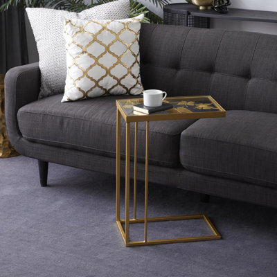 Metal side table with transparent glass top