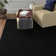 Esther Solid Color Machine Made Tufted Polypropylene Area Rug in Black