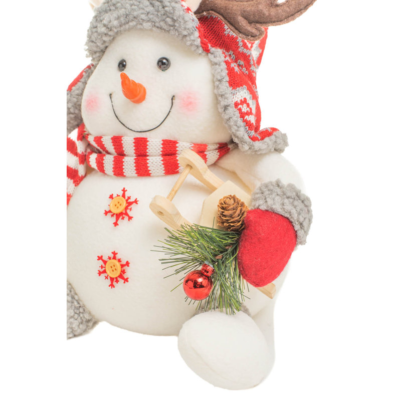 Bonhomme de neige blanc assis