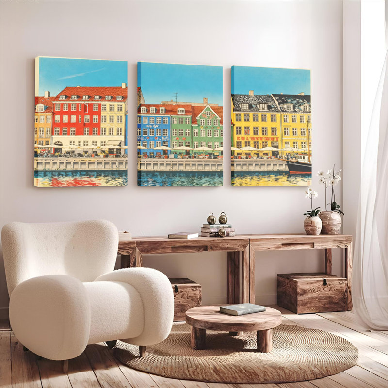 Ensemble de 3 toiles murales colorées représentant des bâtiments scandinaves et des reflets sur un canal., H 18 po x l 36 po