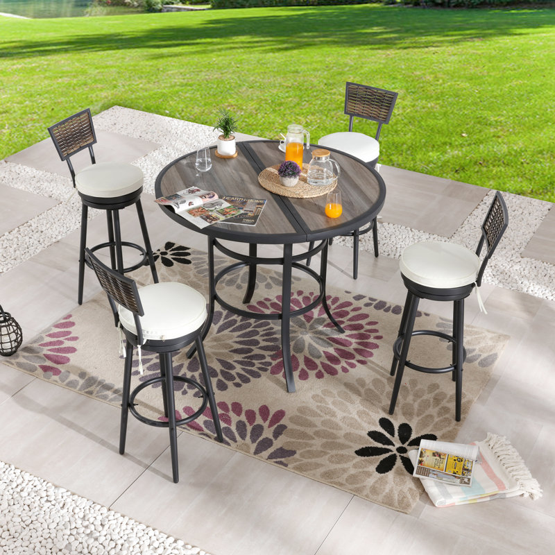 Gunselman 4 - Person Wicker Patio Dining Set with Round Table