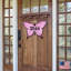 Fixation murale papillon