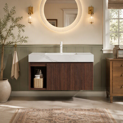 Meuble-lavabo avec lavabo suspendu, comptoir en pierre frittée, lavabo en céramique et trou pré-percé pour robinetterie.