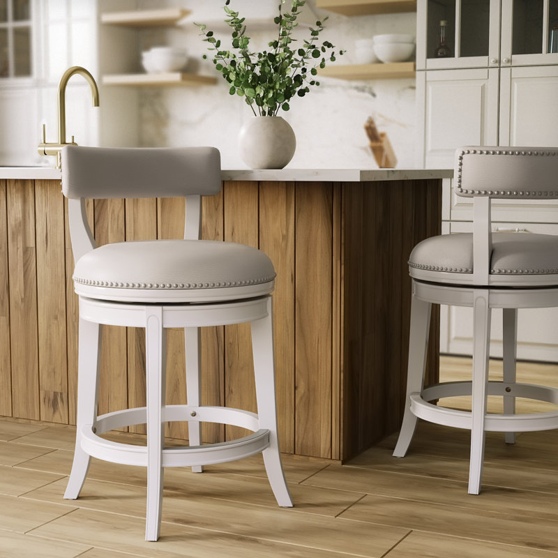 Tabouret de comptoir pivotant rembourré avec structure en bois massif Carollynn