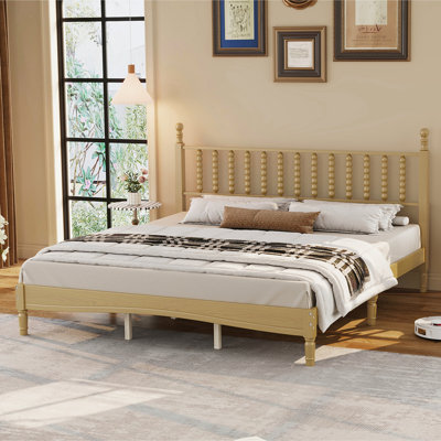 Grand lit plateforme en bois avec tête de lit en forme de gourde