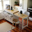 Îlot de cuisine 74,5 pouces avec table de salle à manger extensible, îlot de cuisine sur roulettes avec support à épices et 2 tiroirs, armoire 4 portes, pour la cuisine, la salle à manger, blanc