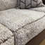 Sofa deux places en similicuir avec coussins en peau de mouton bouclée et coussins décoratifs