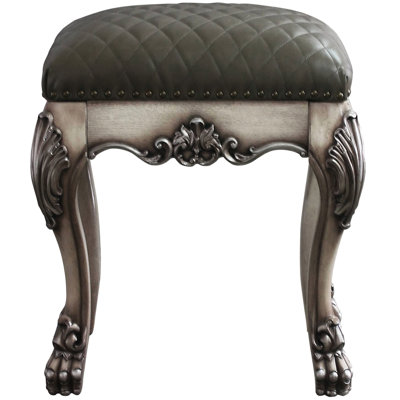 Tabouret de coiffeuse gris avec détails blanc os rétro, ajoutant du caractère à l'attrait de la chambre à coucher