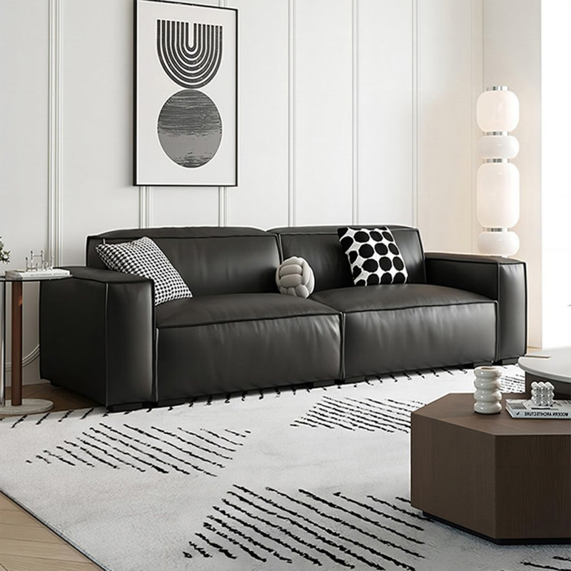 Causeuse-coussin modulable noire en cuir véritable