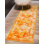 Sandrine Ikat Area Rug in Orange