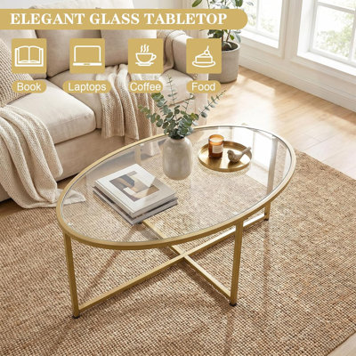 Table basse ovale en verre doré