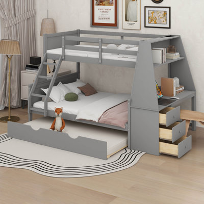 Lit simple superposé au dessus d'un lit double avec lit gigogne et bureau intégré