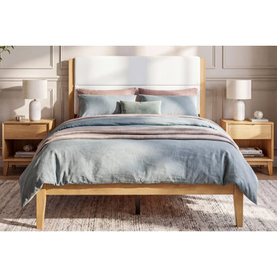 Design élégant Mid-Century: Combinant la chaleur du bois naturel avec une tête de lit tapissée sophistiquée, cette base de lit plateforme apporte une esthétique moderne Mid-Century intemporelle à tout décor de chambre à coucher. Les lignes épurées et les pieds fuselés créent un style minimaliste