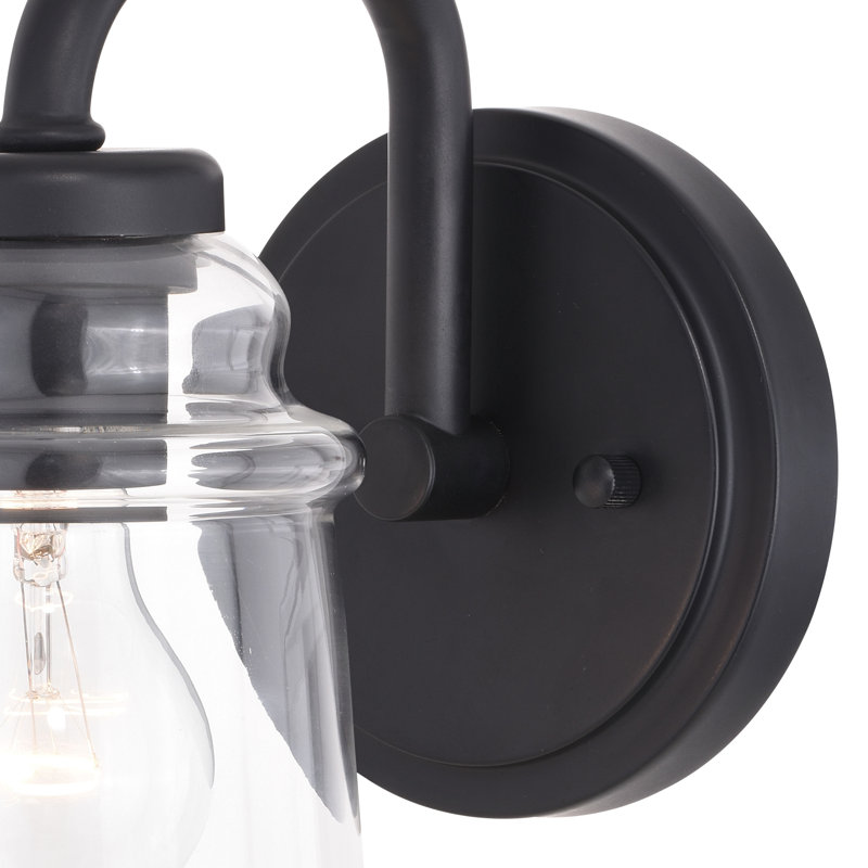 Luminaire de salle de bain industriel noir mat à 1 lumière de 5,25 pouces de large Akini, abat-jour en verre transparent, à intensité variable, compatible avec DEL, applique murale en acier