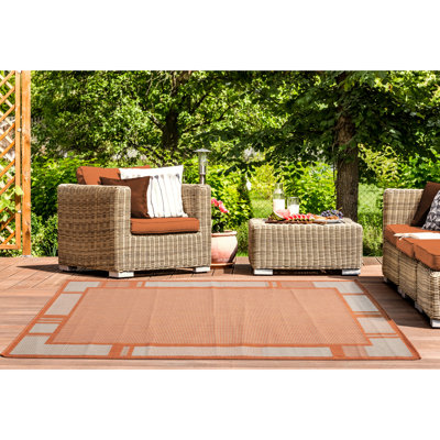 Tapis orange à motif géométrique Kazen