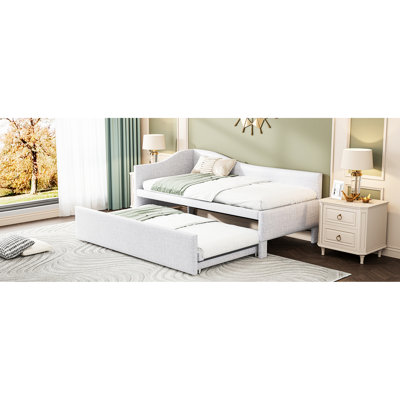 Lit de jour simple rembourré en L beige avec lit gigogne escamotable, idéal pour le salon