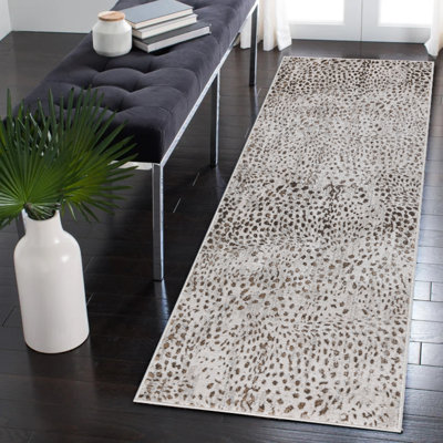 Tapis beige et doré à imprimé animal de la collection Nevada