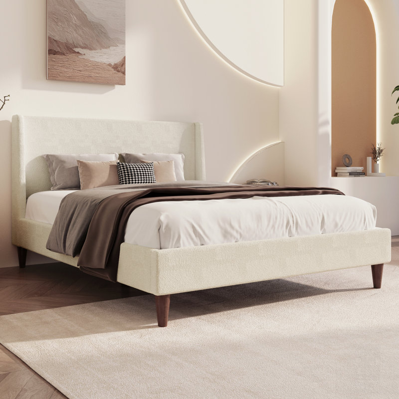 Lit plateforme tapissier moderne avec tête de lit à oreilles, pieds en noyer, sans sommier