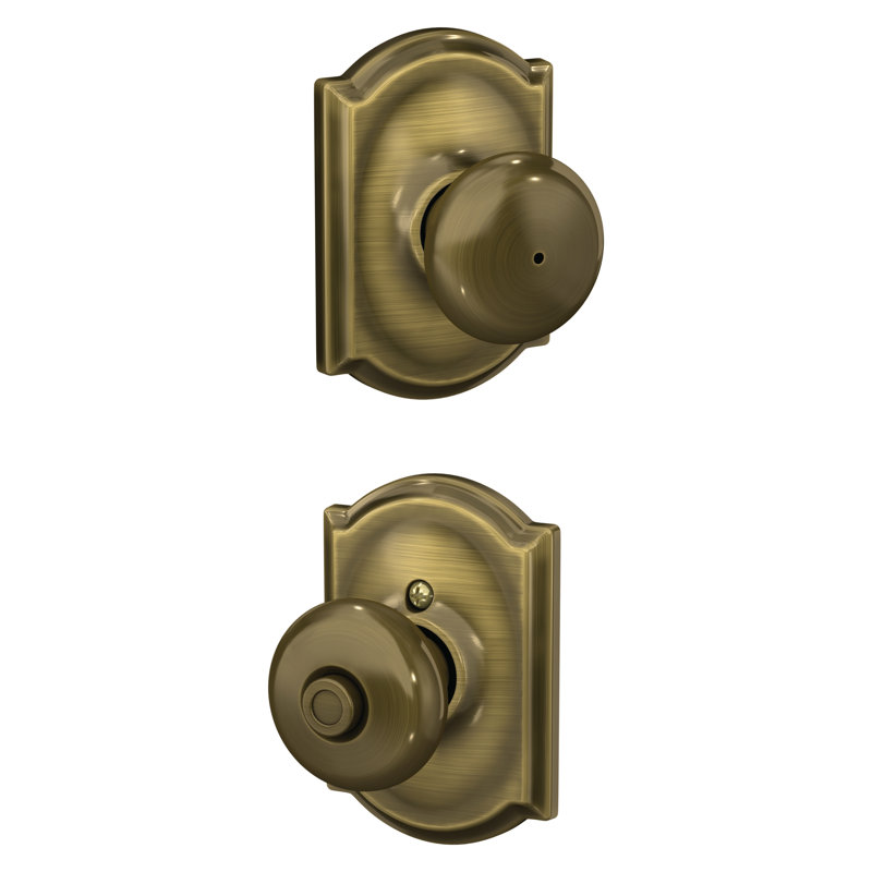 Plymouth Knob with Camelot Trim Bed and Bath Lock, Antique Brass