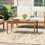 Table basse de patio en bois d'acacia avec pattes sculptées Parker