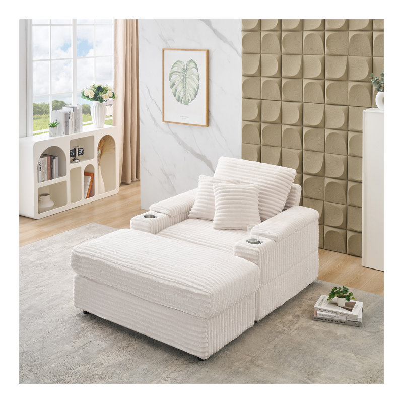 Canapé simple en velours côtelé beige avec un coussin, deux coussins décoratifs, un repose-pieds et deux espaces de rangement