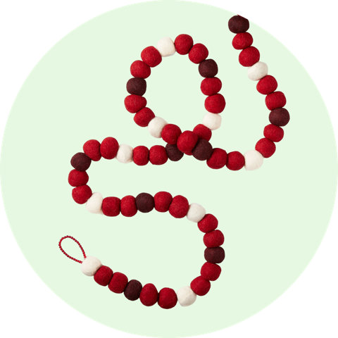 Felt ball garland with red, white, and burgundy balls.