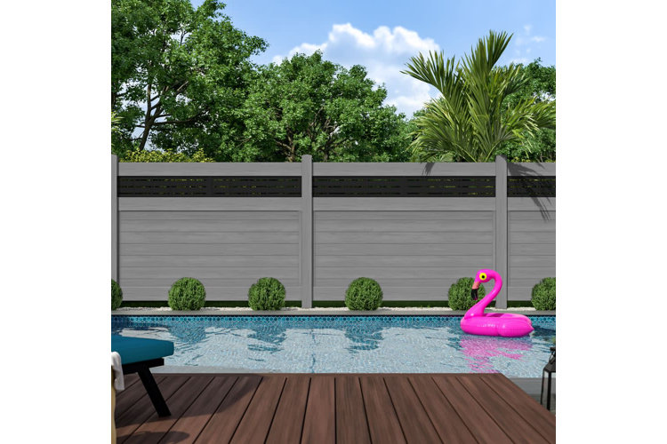 in-ground swimming pool surrounded by a brown wood privacy fence
