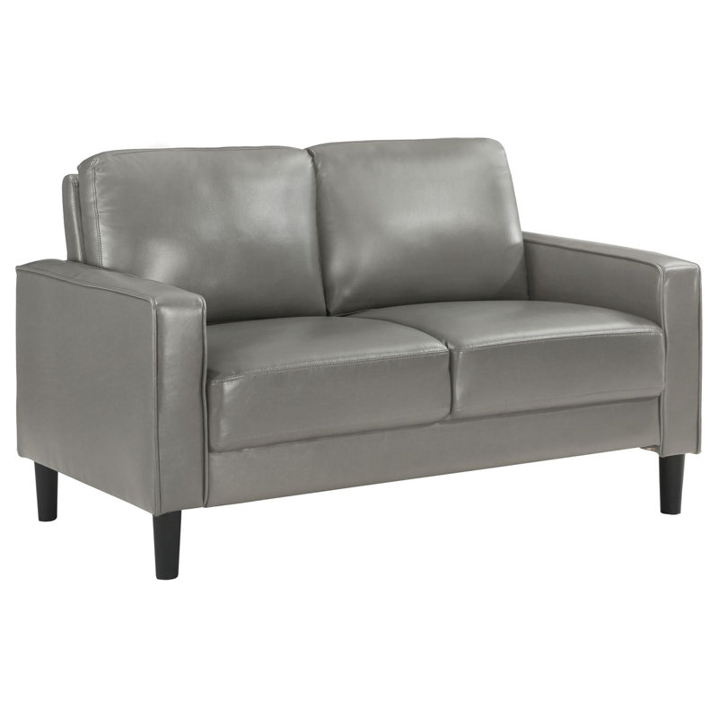 Causeuse rembourrée avec accoudoirs Farallone, parfaite pour la vie moderne avec confort et style dans des espaces compacts.