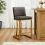 Tabouret de comptoir gris Forsyth de 24 po avec similicuir rembourré et structure en métal doré-1453260455