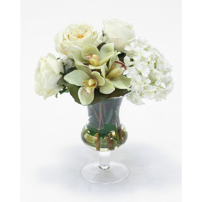 Waterlook (R) White Roses And Hydrangeas With Cymbidium Orchids In Clear Glass Urn