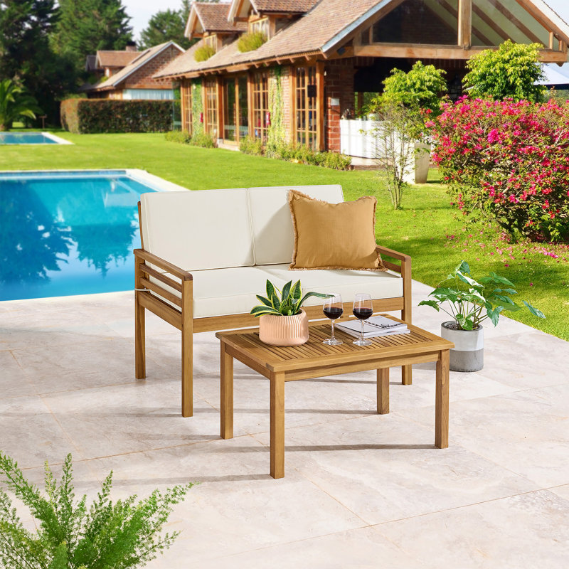 Alaterre Furniture Okemo Weather-Resistant Acacia Wood Outdoor Patio Furniture With A 44" Wide 2 Seater Couch With Cushions And A 31.5" Wide Rectangular Coffee Table, Natural Wood with Cream Cushions