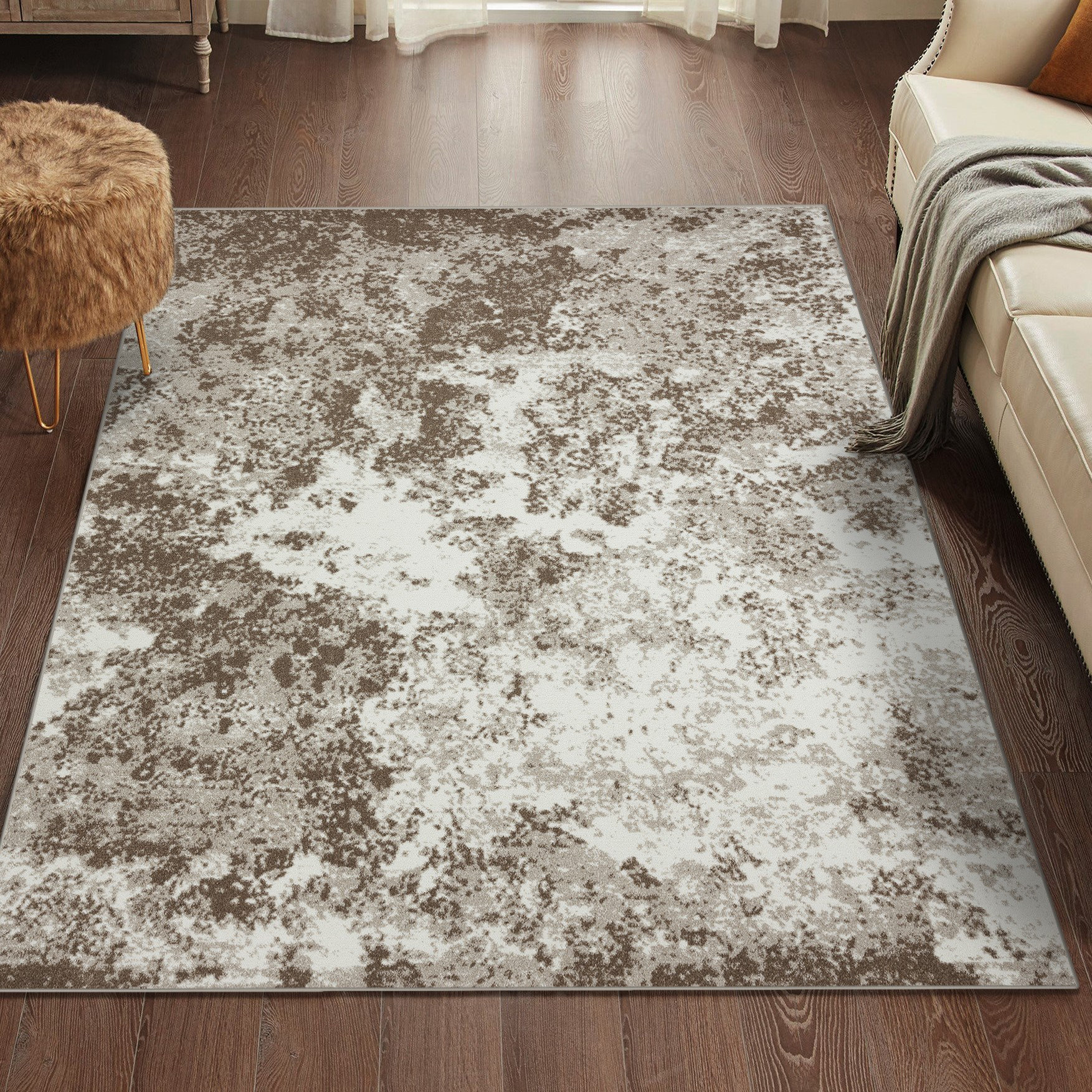 HomeRoots 5' x 8' Modern Faux Cowhide Fabric Area Rug in Brown/White