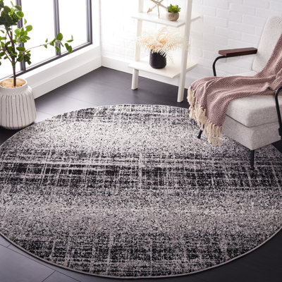 Riebe Abstract Silver/Black Area Rug