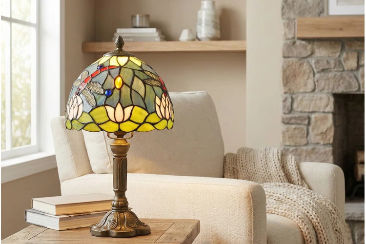 round Tiffany lamp with a dragonfly pattern on a wooden end table