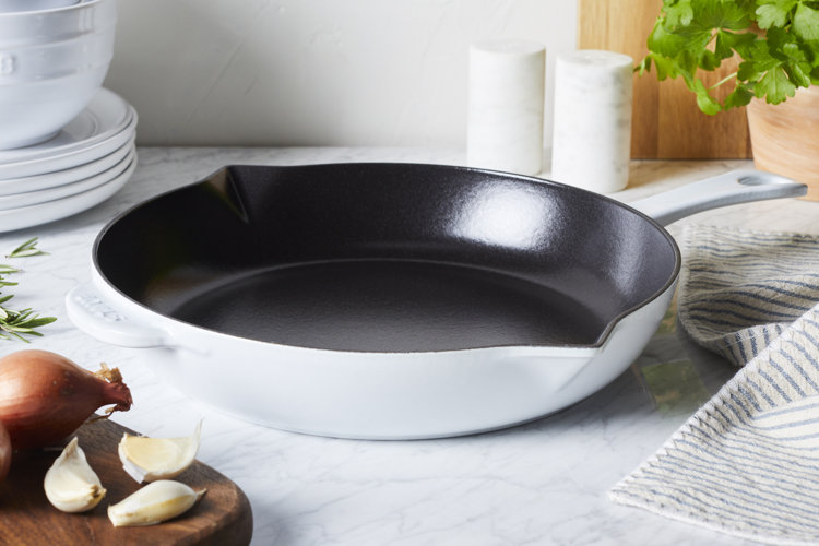 white enameled cast iron skillet
