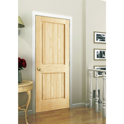 Porte standard à panneaux en bois manufacturé massif