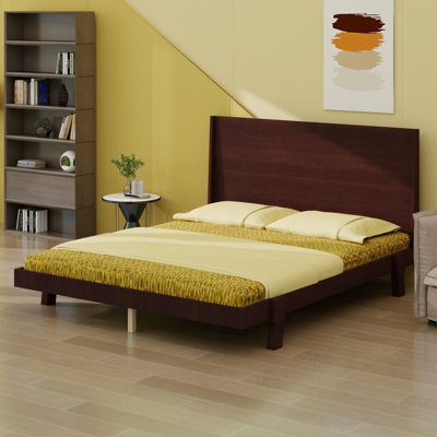 Platform bed frame with statement headboard and angled tapered legs, mid-century modern low-profile design