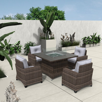 Schwerin Wicker 4 - Person Patio Conversation Set with Cushions