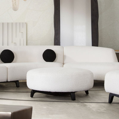 Vesper Round Ottoman In Faux White Shearling W/ Black Wood Leg Base