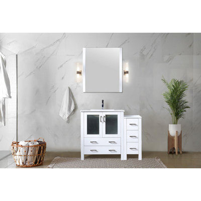 Meuble-lavabo blanc de 107 cm (42 po) - Structure en bois massif et armoire latérale avec comptoir en céramique. Système de fermeture amortie. Tiroirs robustes et pratiques, résistants à l'usure.