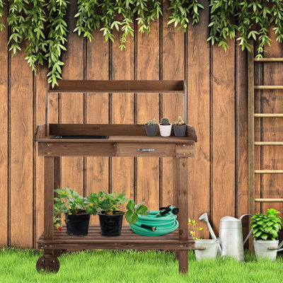 Station de rempotage en bois brun de 36 po avec évier, tiroir, 2 roulettes amovibles et un espace de rangement adéquat - Roues de table d'établi pour l'extérieur, espace abondant, jardinage