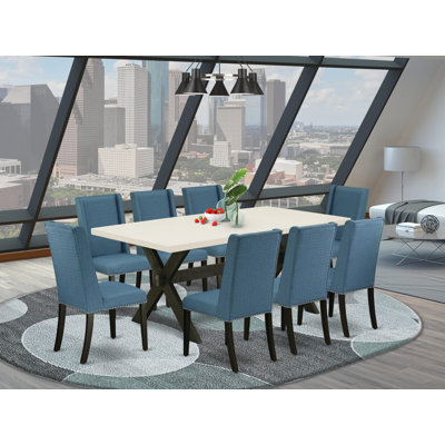 L'ensemble de salle à manger 5 pièces comprend une table de salle à manger rectangulaire avec des pieds en X et 4 chaises Parson rembourrées en tissu noir, noir brossé