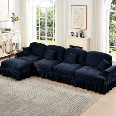 Canapé à quatre places en chenille bleue avec coussin évasé, mobile et décoratif pour une assise confortable et modulaire