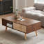 Table basse Boho avec pieds en bois massif et tiroir de rangement coulissant-322085557