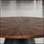 Table basse ronde de style contemporain avec plateau biseauté et base cylindrique, parfaite pour les espaces de vie modernes